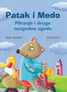 Patak i medo na motoru kao naslovnica slikovnice